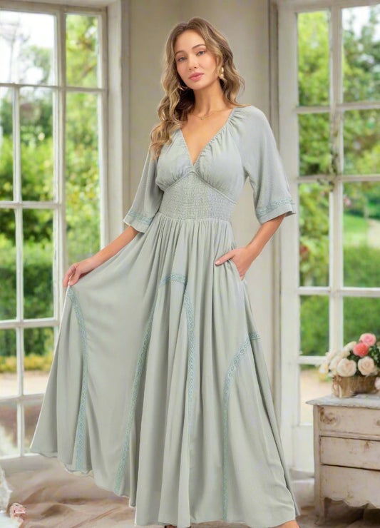 Woman in green flowy pocket dress