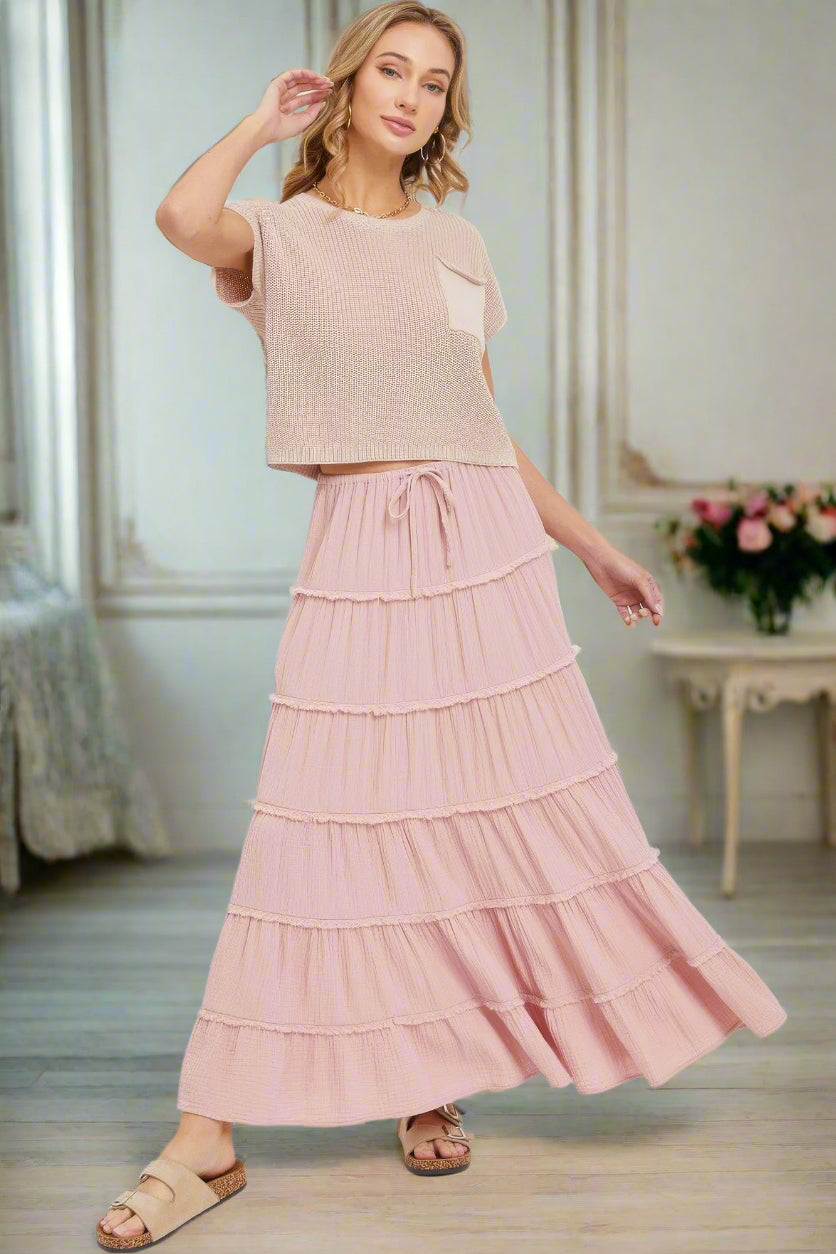 woman in pink skirt maxi length layered in shabby chic room